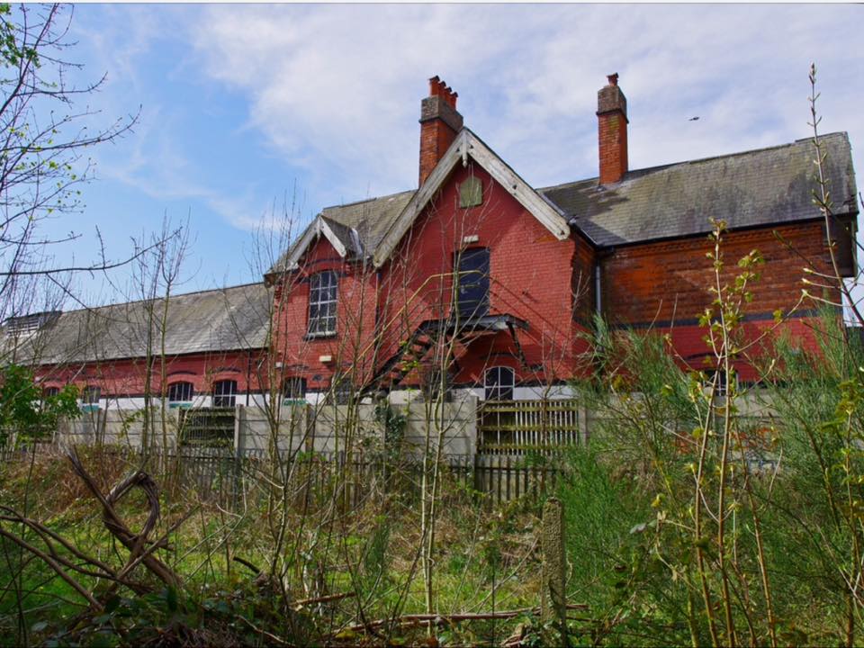 Current view of the rear (platform side) of the station the other side of the disused railway line